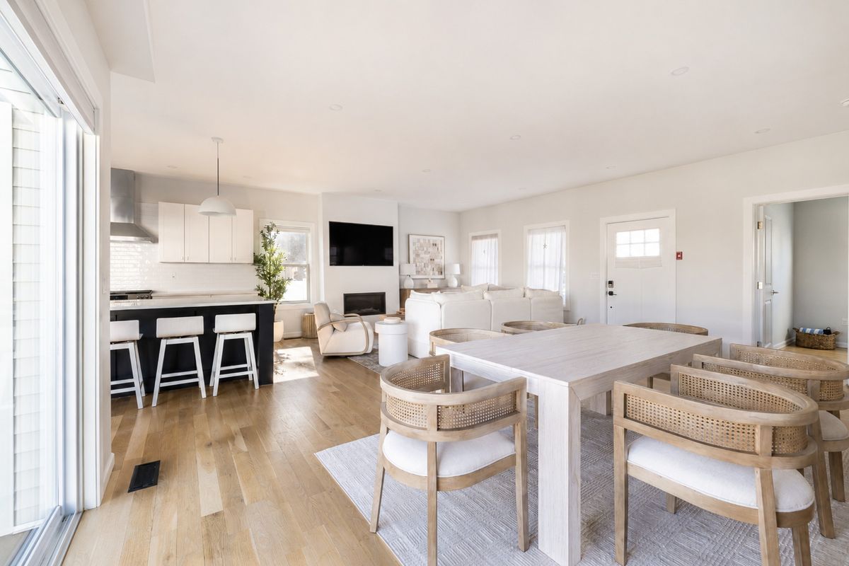Living room with the Montigo gas fireplace and the dining area open to the kitchen.