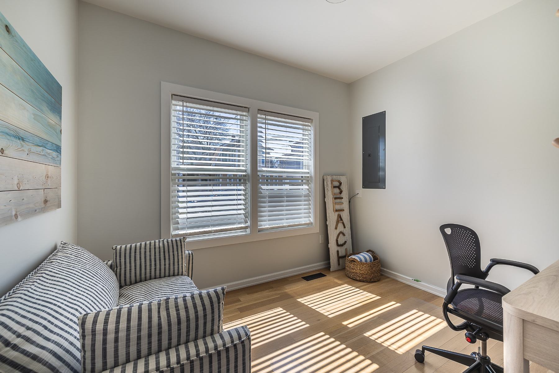 Dedicated private office on the main level with natural light and a Herman Miller chair.